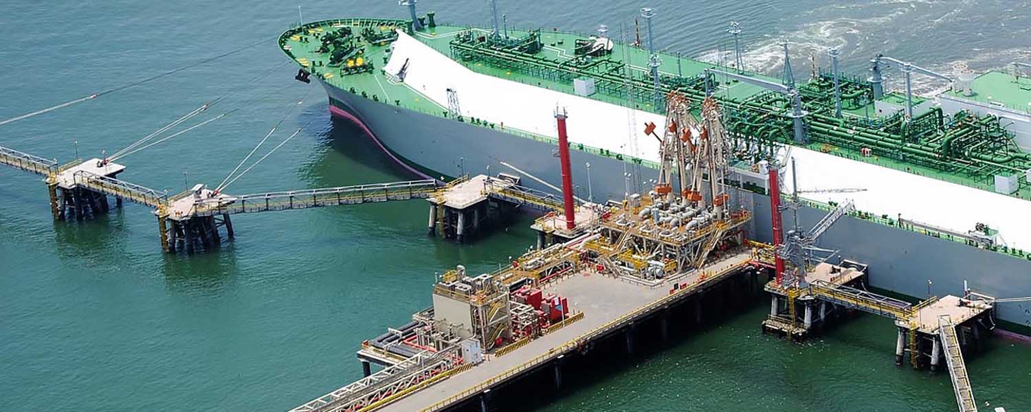 Industrial zone, Steel pipelines and valves against blue sky